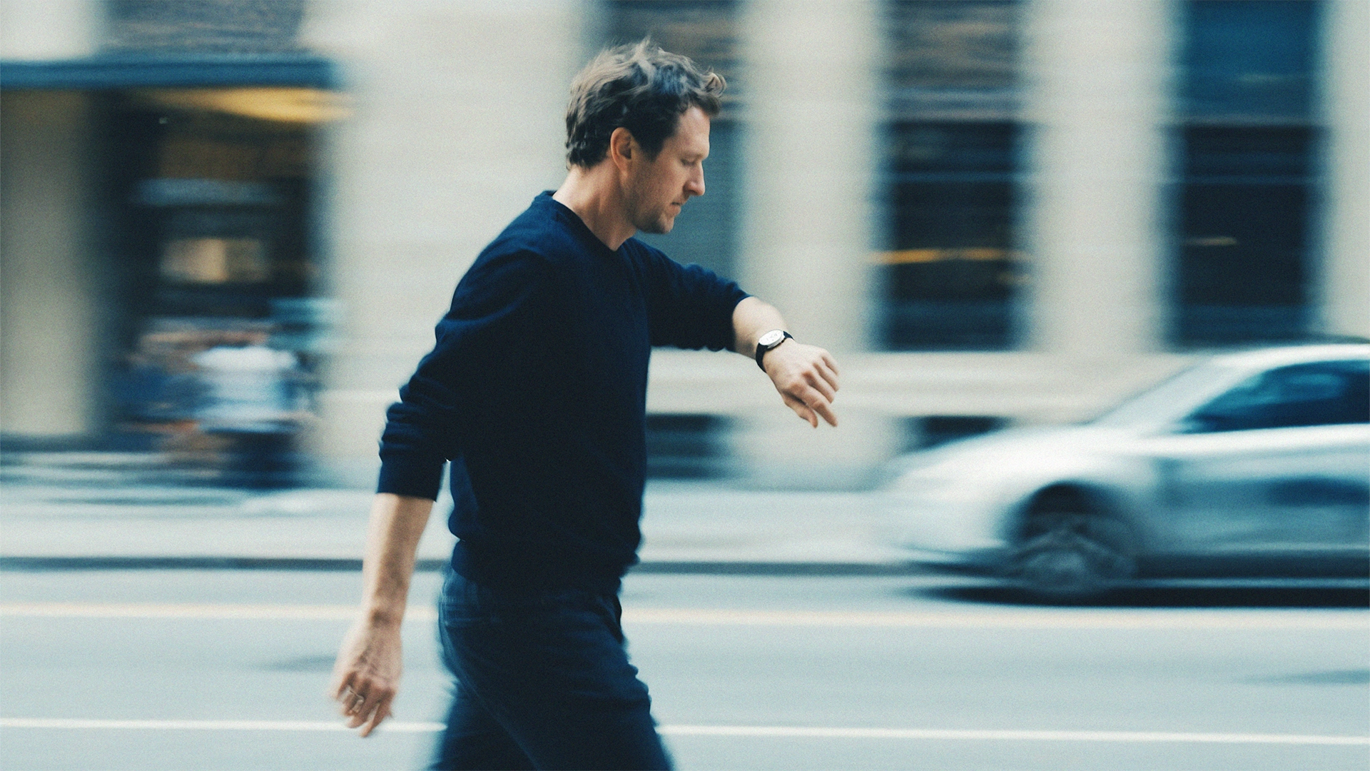 Business woman in high heels has her feet on the desk. A Keyboard and Computer can be seen in the background.